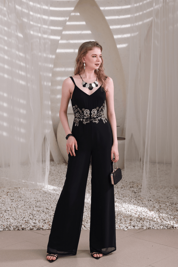 Full-body pose showing flowy wide-leg cut and handcrafted embellishments