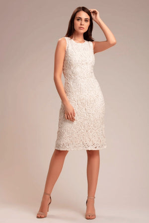 Model with arms raised wearing ivory shrug – styling detail shot