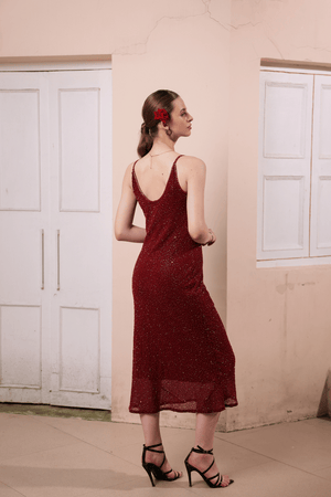 Back view of slip dress showcasing thin straps and dress fall