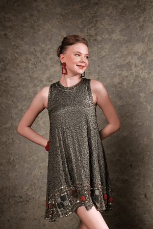 Model wearing olive sequin shift dress – front full-length view