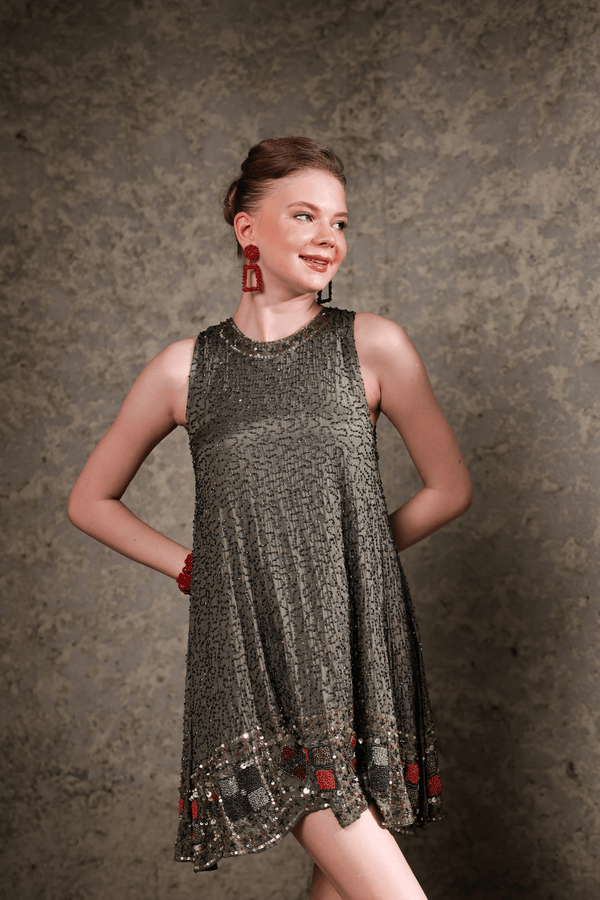 Model wearing olive sequin shift dress – front full-length view