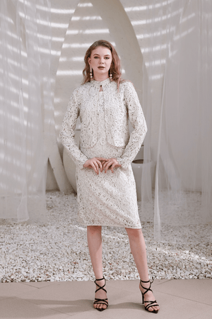 Model wearing ivory hand-beaded lace dress with shrug – front full-length view