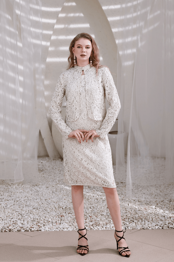 Model wearing ivory hand-beaded lace dress with shrug – front full-length view