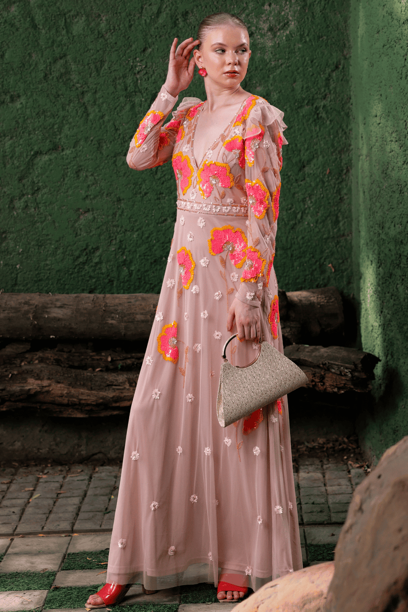 Front view of model wearing peach floral embroidered gown – sleeveless and floor-length