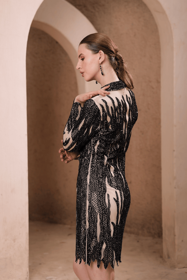 Lifestyle shot: woman wearing Edition Two black flame beaded illusion dress at formal event – modern designer gown India