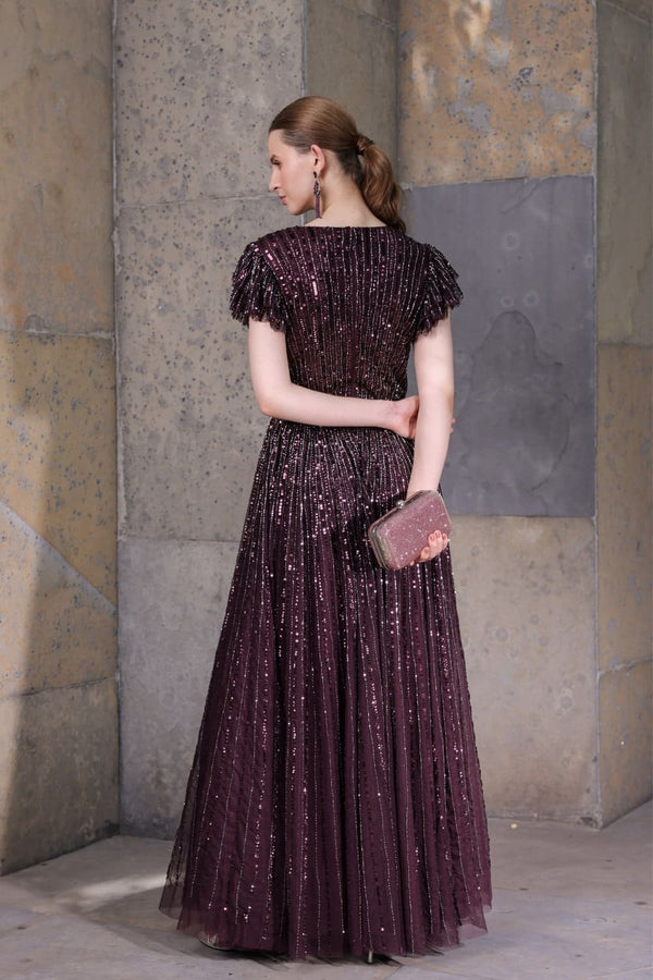 Back view of gown highlighting fit and sleeve detailing