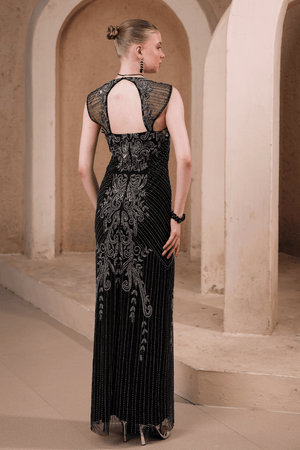 Back view of Edition Two black beaded evening gown with baroque detailing – sheer mesh upper back and ornate baroque motifs