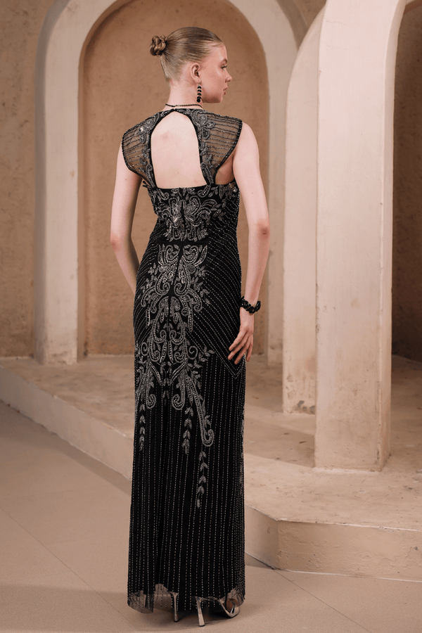 Back view of Edition Two black beaded evening gown with baroque detailing – sheer mesh upper back and ornate baroque motifs