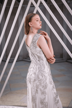 Lifestyle image: woman wearing Edition Two ivory embellished floor-length gown at gala event – designer gown India