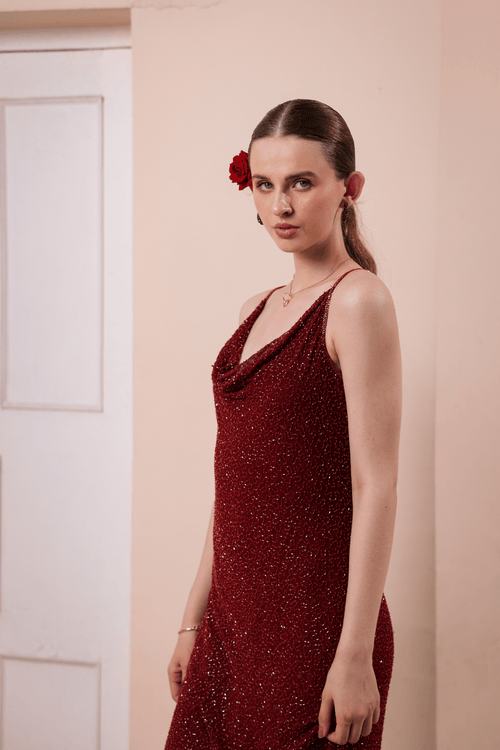 Side profile of slip dress showing beaded detailing and silhouette