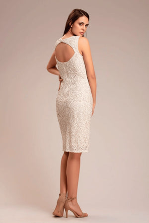 Back view of ivory dress with buttoned shrug and keyhole detail