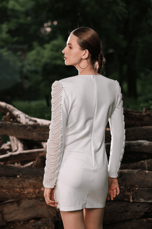 Back view of Edition Two ivory pearl embellished mini dress – low-back design and intricate pearl embroidery