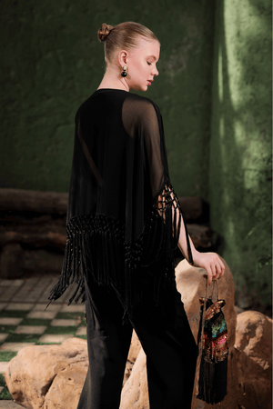 Side angle of Edition Two black beaded fringe cape – sheer georgette silhouette with tonal bead and sequin embroidery