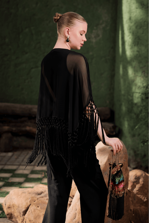 Side angle of Edition Two black beaded fringe cape – sheer georgette silhouette with tonal bead and sequin embroidery