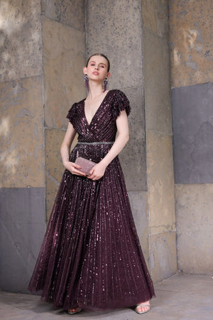 Front view of model wearing blackberry sequin gown with tiered sleeves – full-length