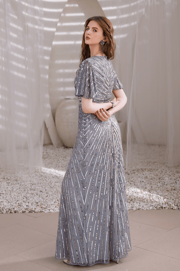 Back view of Edition Two silver hand-beaded gown – floor-length train and intricate beaded detailing