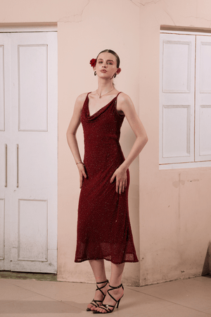 Front view of model wearing wine red hand-embellished slip dress