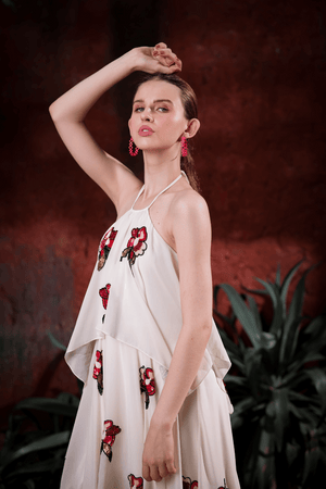Lifestyle shot: woman wearing Edition Two ivory halter dress with hand-embroidered florals at a gala – modern designer gown India