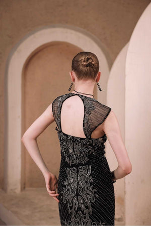 Lifestyle shot: woman wearing Edition Two black beaded evening gown with baroque detailing at a gala – modern women’s formal wear India