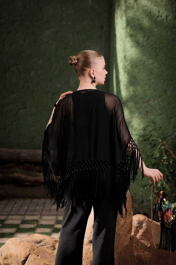 Back view of Edition Two black beaded fringe cape – flowing fringe hem and open-front cape design for modern festive look