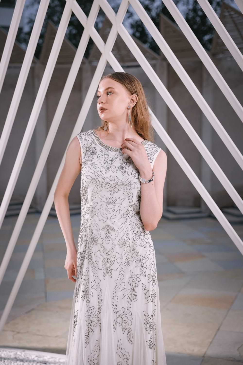 Close-up of hand-embellished bead and floral embroidery on Edition Two ivory floor-length gown – premium craftsmanship