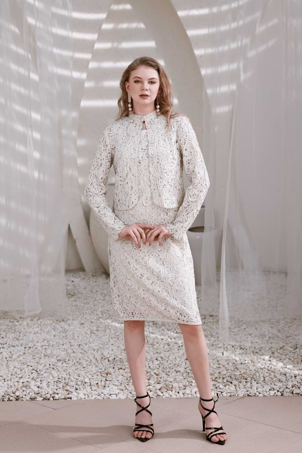 Model wearing ivory hand-beaded lace dress with shrug – front full-length view