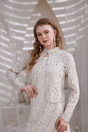 Front close-up of ivory lace shrug showing sheer embroidered texture