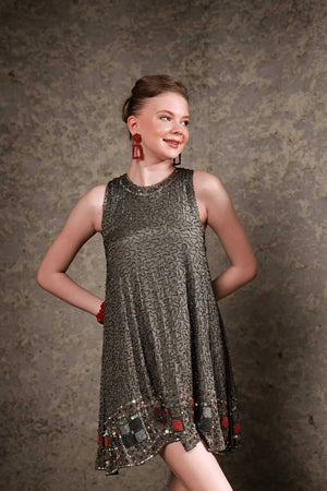 Model wearing olive sequin shift dress – front full-length view
