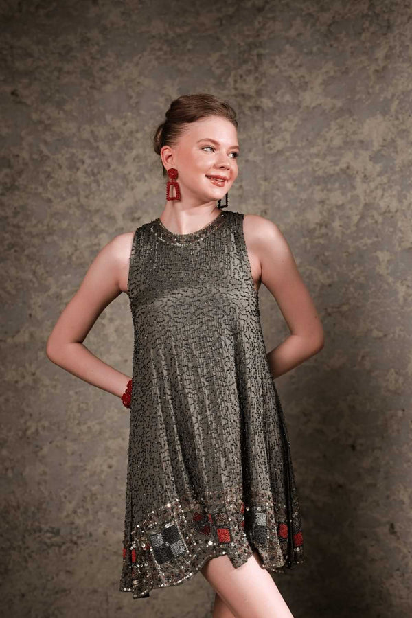 Model wearing olive sequin shift dress – front full-length view