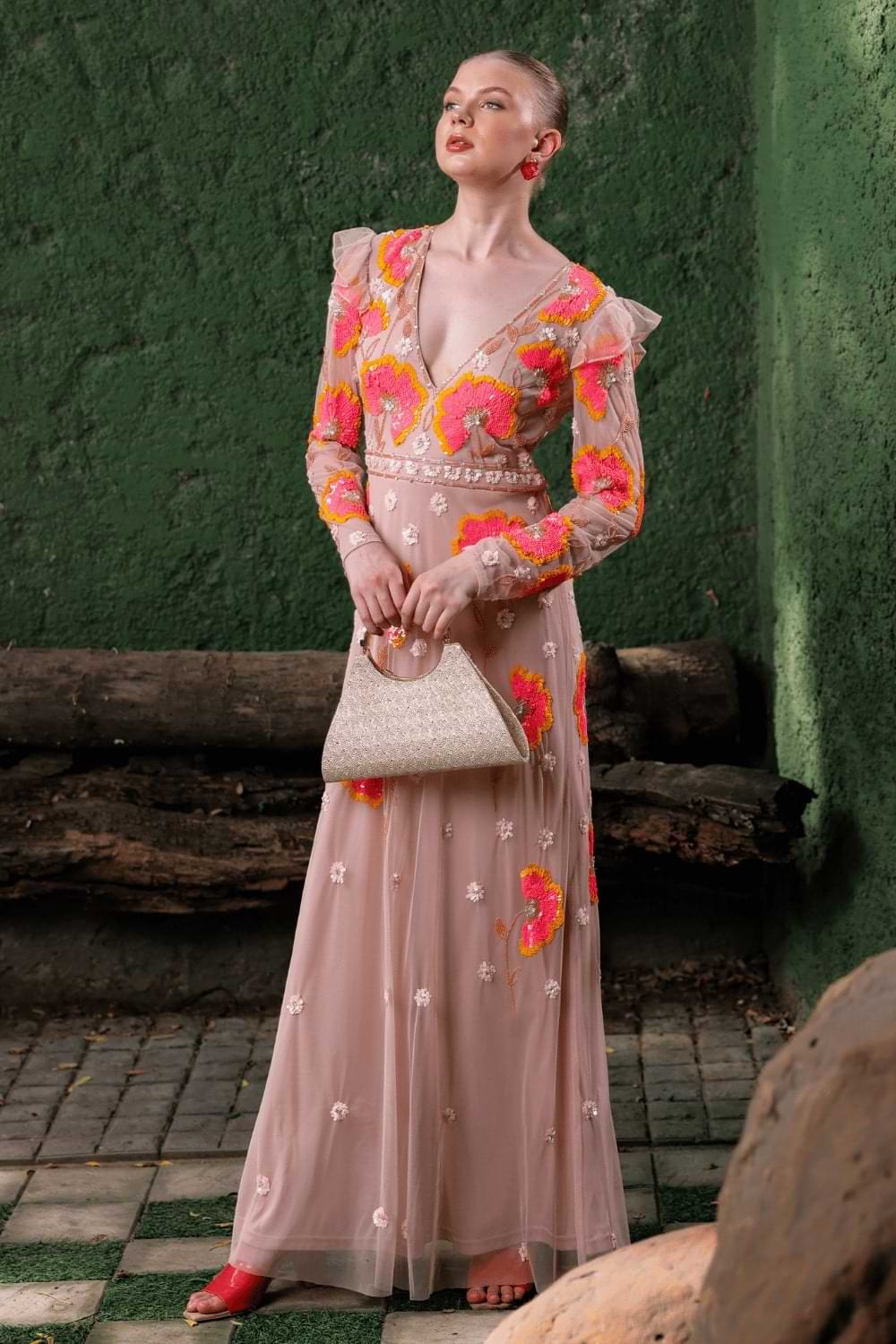 Front view of model wearing peach floral embroidered gown – sleeveless and floor-length