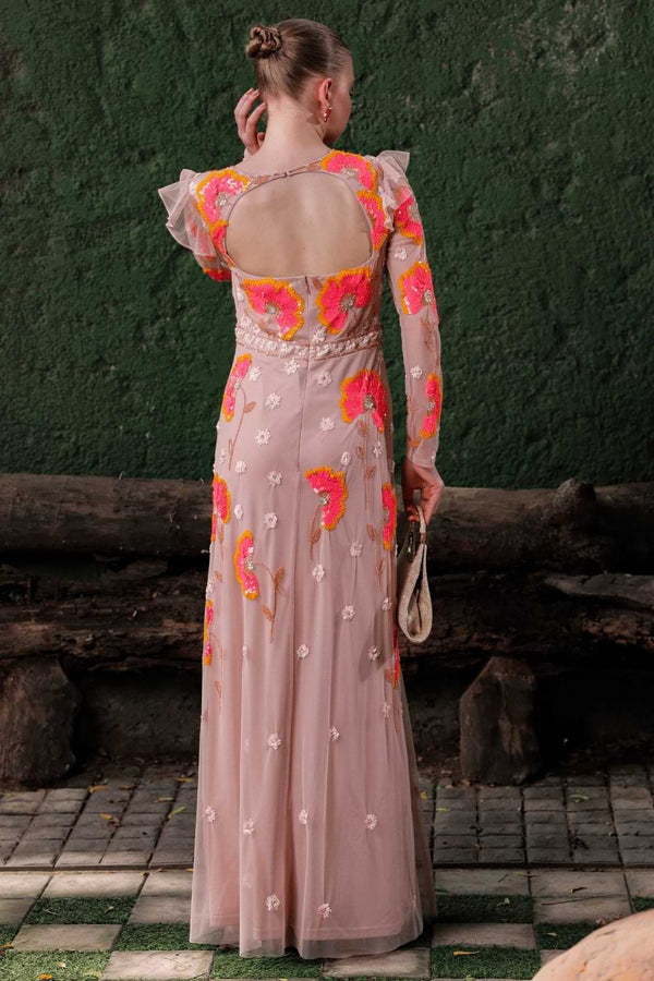 Back view of peach embroidered gown with zipper closure and flowing hem