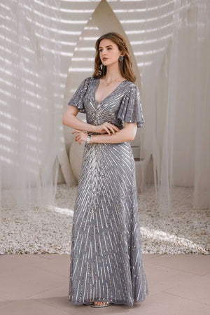 Lifestyle shot: woman wearing Edition Two silver hand-beaded gown at gala event – designer dress India