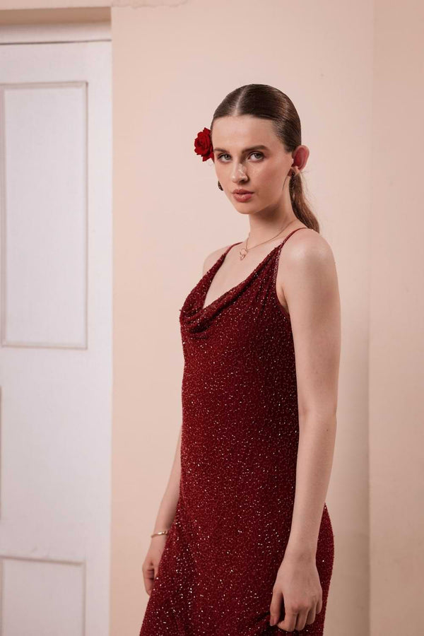 Side profile of slip dress showing beaded detailing and silhouette