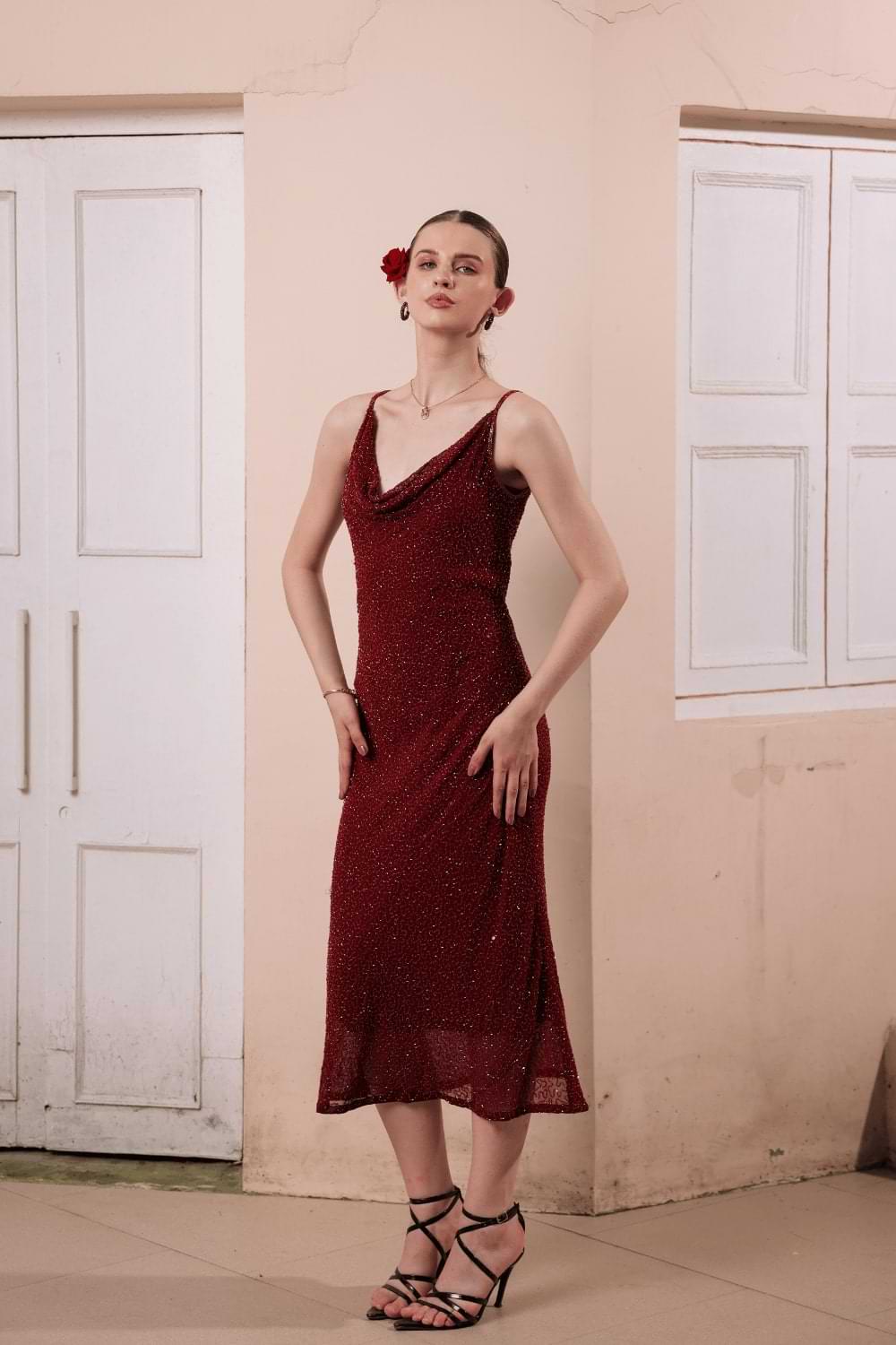 Side profile of slip dress showing beaded detailing and silhouette